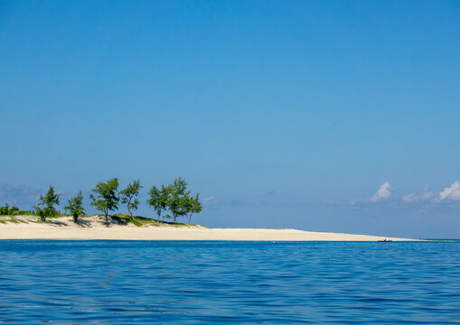 White sand sandbar with palms on Goa Island, Island of Mozambique